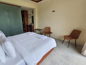 Letto o letti in una camera di Kuredhi View