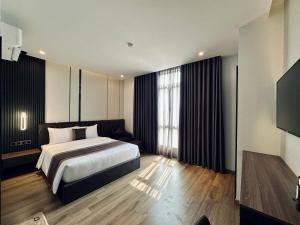 Postel nebo postele na pokoji v ubytování LION 15 Hotel