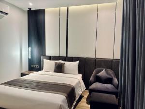 Postel nebo postele na pokoji v ubytování LION 15 Hotel