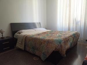 A bed or beds in a room at La casa sul mare-Savona