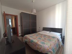 A bed or beds in a room at La casa sul mare-Savona