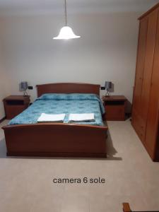 Postel nebo postele na pokoji v ubytování Locanda Primo Sole