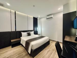 Postel nebo postele na pokoji v ubytování LION 15 Hotel