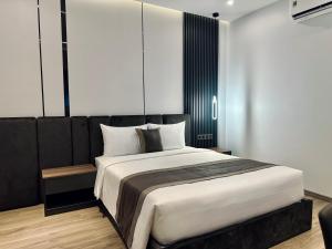 Postel nebo postele na pokoji v ubytování LION 15 Hotel