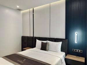 Postel nebo postele na pokoji v ubytování LION 15 Hotel