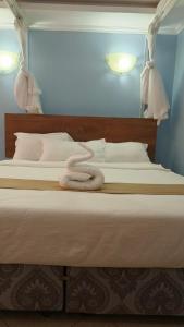 Postel nebo postele na pokoji v ubytování Savannah Paradise Hotel