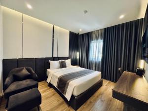 Postel nebo postele na pokoji v ubytování LION 15 Hotel