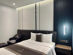 Postel nebo postele na pokoji v ubytování LION 15 Hotel