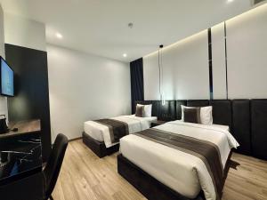 Postel nebo postele na pokoji v ubytování LION 15 Hotel