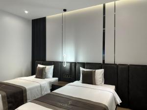 Postel nebo postele na pokoji v ubytování LION 15 Hotel