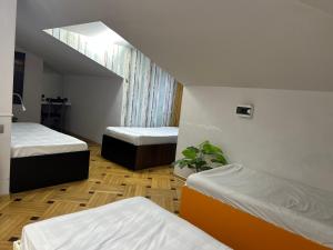 Ένα ή περισσότερα κρεβάτια σε δωμάτιο στο Porta Hostel