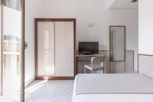 TV a/nebo společenská místnost v ubytování Hotel Serapo