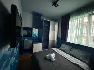 Ένα ή περισσότερα κρεβάτια σε δωμάτιο στο Porta Hostel