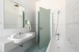 Koupelna v ubytování Hotel Serapo