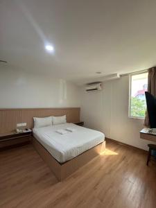 Postel nebo postele na pokoji v ubytování Mint Hotel
