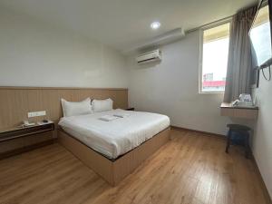 Katil atau katil-katil dalam bilik di Mint Hotel
