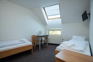 Voodi või voodid majutusasutuse Apartmány U Gigantu toas