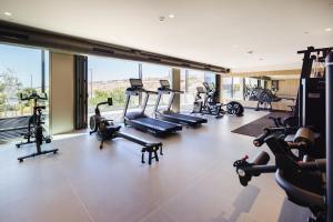 a gym with several treadmills and exercise bikes at BANCAL HOTEL and SPA in San Sebastián de la Gomera
