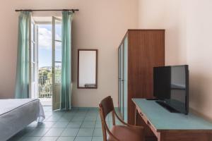 TV a/nebo společenská místnost v ubytování Hotel Serapo