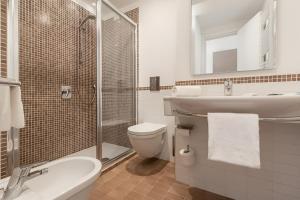 Koupelna v ubytování Hotel Serapo