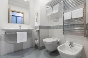 Koupelna v ubytování Hotel Serapo
