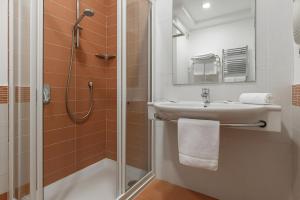 Koupelna v ubytování Hotel Serapo