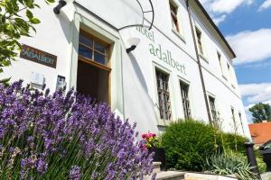 a building with purple flowers in front of it at Adalbert Ecohotel in Prague