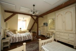 Postel nebo postele na pokoji v ubytování Pension Grant Lux Znojmo