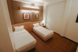 Postel nebo postele na pokoji v ubytování Fomecs Boutique Hotel, Jonker Street