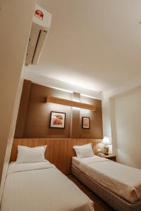 Postel nebo postele na pokoji v ubytování Fomecs Boutique Hotel, Jonker Street