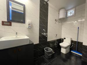 a bathroom with a sink and a toilet at Storica Stays in Jodhpur +32 photos
