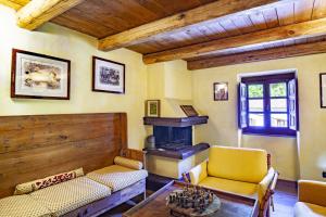 a living room with a couch and a fireplace at Il guardiano del Castello in Fivizzano