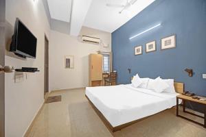 Postel nebo postele na pokoji v ubytování Hotel Sadha Siva