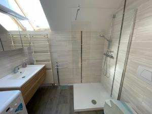 a bathroom with a shower and a toilet and a sink at Apartment Schlager Maria in Pirkach +22 photos
