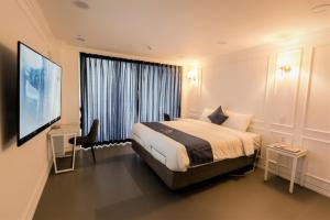 Postel nebo postele na pokoji v ubytování Gladsheim Hotel
