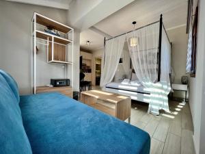 Posteľ alebo postele v izbe v ubytovaní PORTO PORTES suites