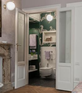 a bathroom with a sink and a toilet and a tub at Zebra Rosso in Milan