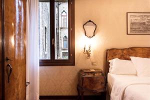 Postel nebo postele na pokoji v ubytování Hotel Flora + 37 fotografií