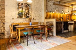 a kitchen with a wooden table and chairs at Gut Neuwerk in Kall
