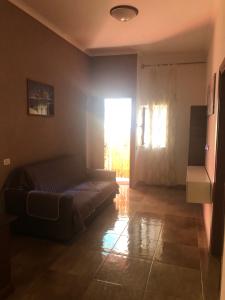 a bedroom with a bed in a room with a window at Casa Nonna Rosa in Nettuno