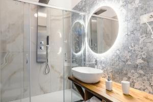 a bathroom with a sink and a shower at BeB Domus Arbenzio San Giovanni Suite in Rome +49 photos