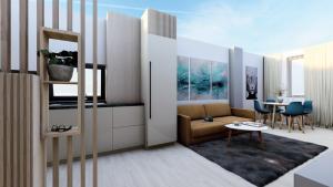 una sala de estar con un sofá y una mesa en VIBE Apartments, en Năvodari