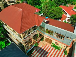 an overhead view of a house with a red roof at River House Lodge in Arusha