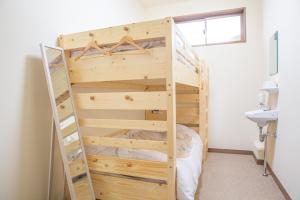Postel nebo postele na pokoji v ubytování バードランド