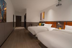 Voodi või voodid majutusasutuse Mcsrh Hotel-Hangzhou Xihu toas