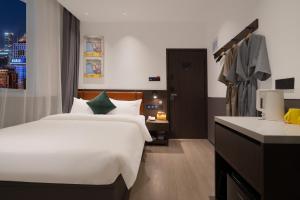 Voodi või voodid majutusasutuse Mcsrh Hotel-Hangzhou Xihu toas