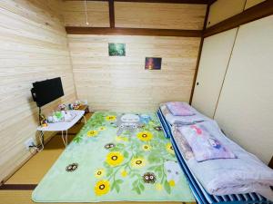 Postel nebo postele na pokoji v ubytování 旅馆yo ko