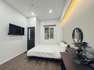 TV a/nebo společenská místnost v ubytování Vĩnh Tuấn Hotel