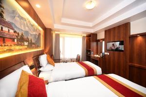 Letto o letti in una camera di Hotel Friends Home