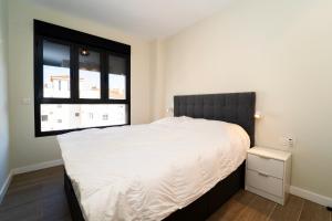 En eller flere senge i et værelse på BM5J, Big duplex penthouse with two terraces + 17 billeder